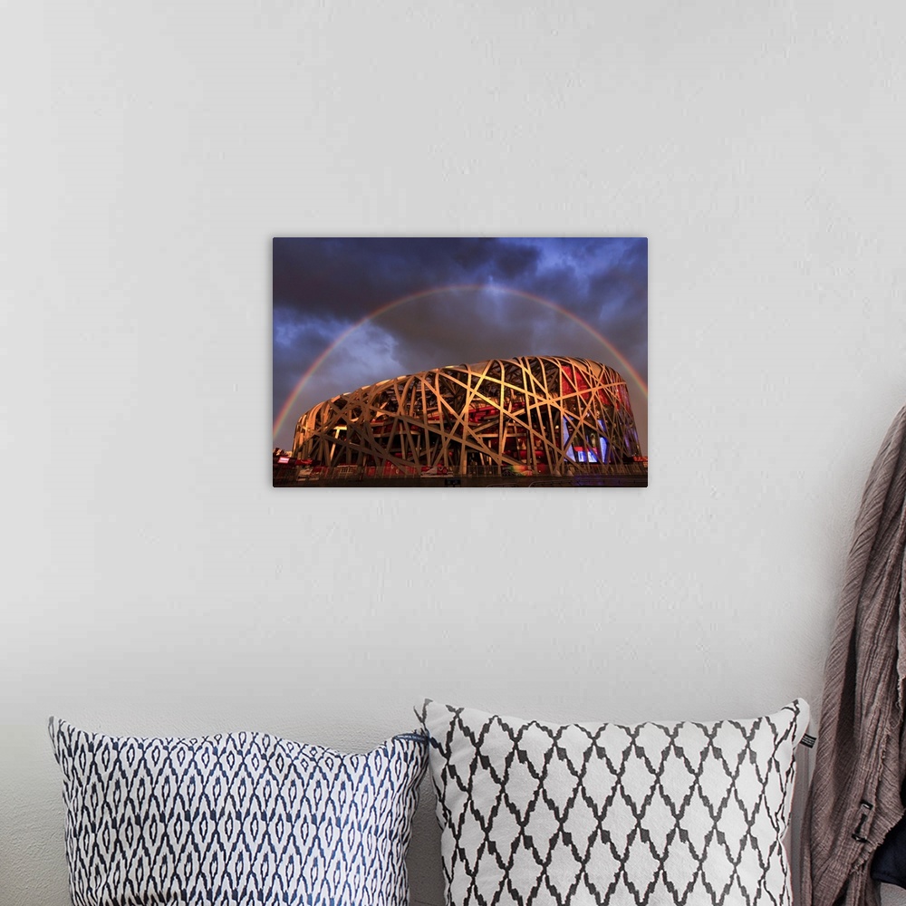 A bohemian room featuring China, Beijing, Olympic park and famous bird's nest stadium made of steel illuminated by a colorf...