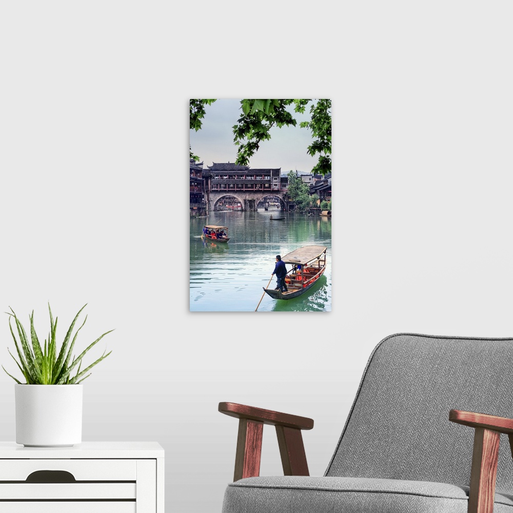 A modern room featuring China, Hunan province, Fenghuang, riverside houses.
