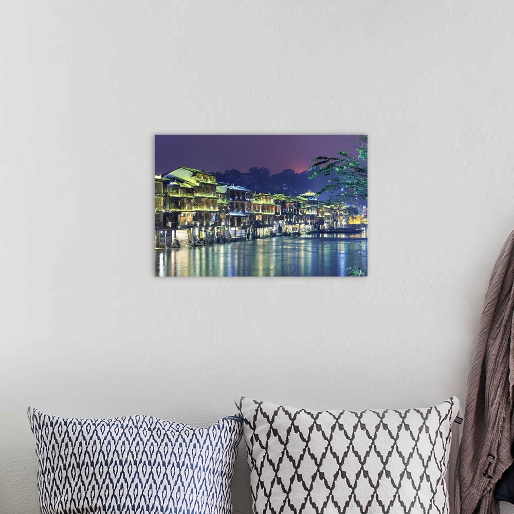 A bohemian room featuring China, Hunan province, Fenghuang, riverside houses.