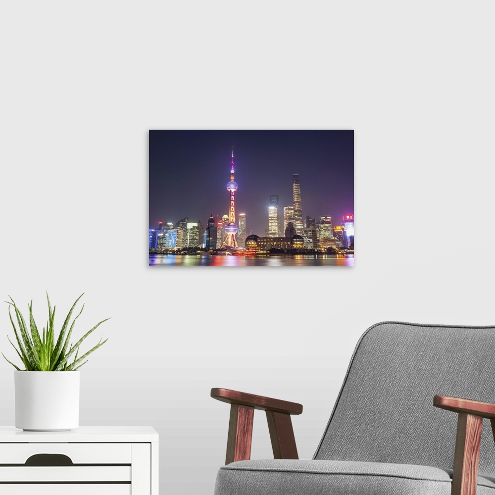 A modern room featuring China, Shanghai, The Bund, Pudong Skyline across the Huangpu River.