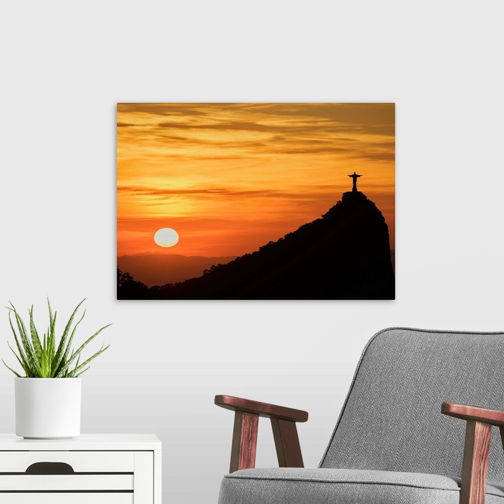 A modern room featuring Christ the Redeemer and Corcovado Mountain at sunrise, Rio de Janeiro, Brazil