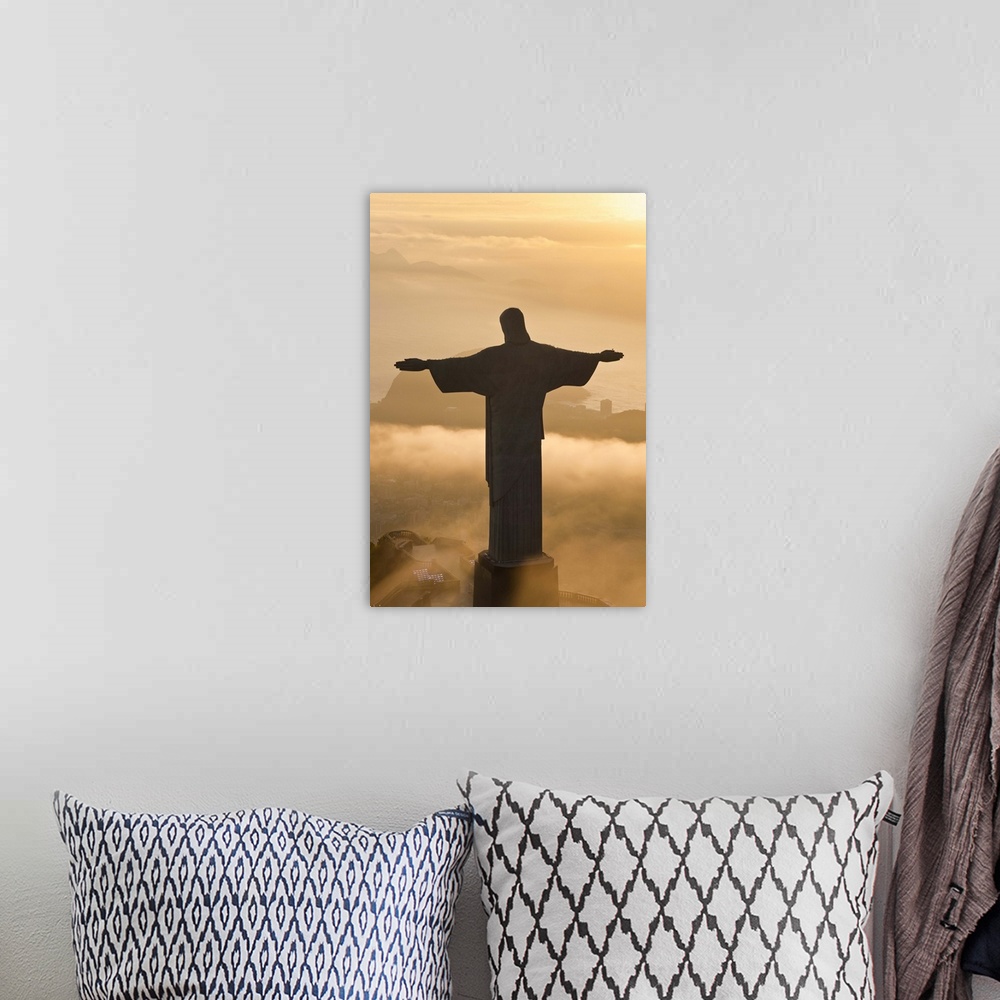 A bohemian room featuring The giant Art Deco statue of Jesus, known as Cristo Redentor (Christ the Redeemer), on Corcovado ...