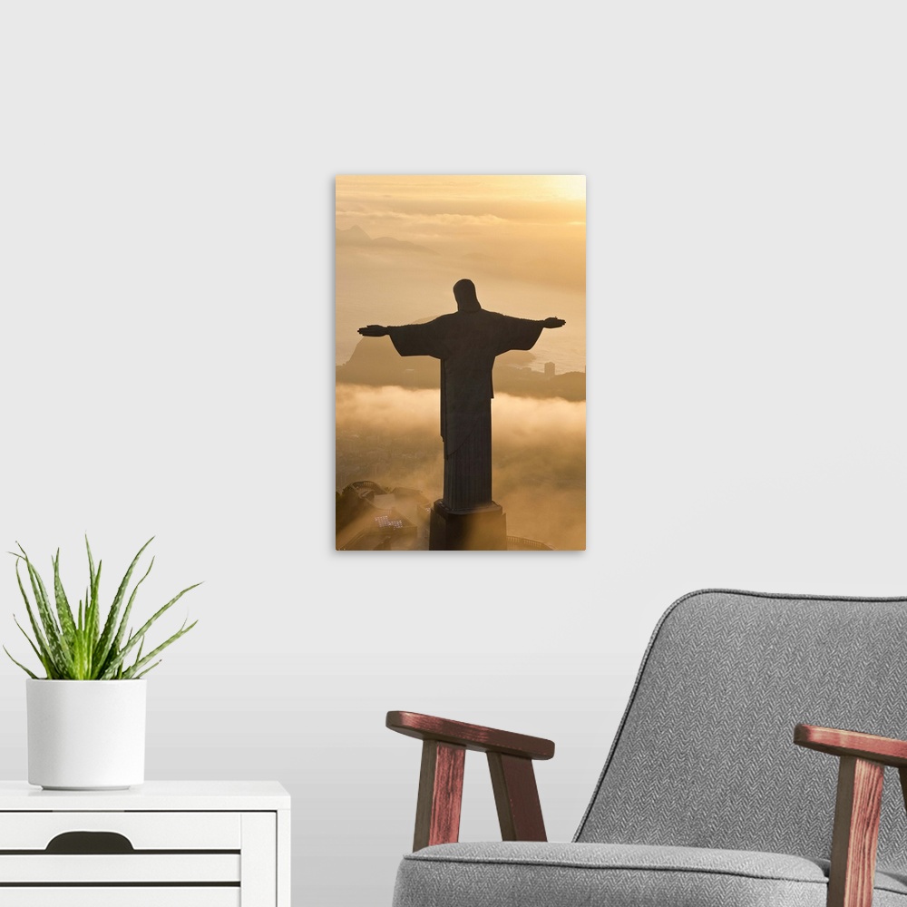 A modern room featuring The giant Art Deco statue of Jesus, known as Cristo Redentor (Christ the Redeemer), on Corcovado ...