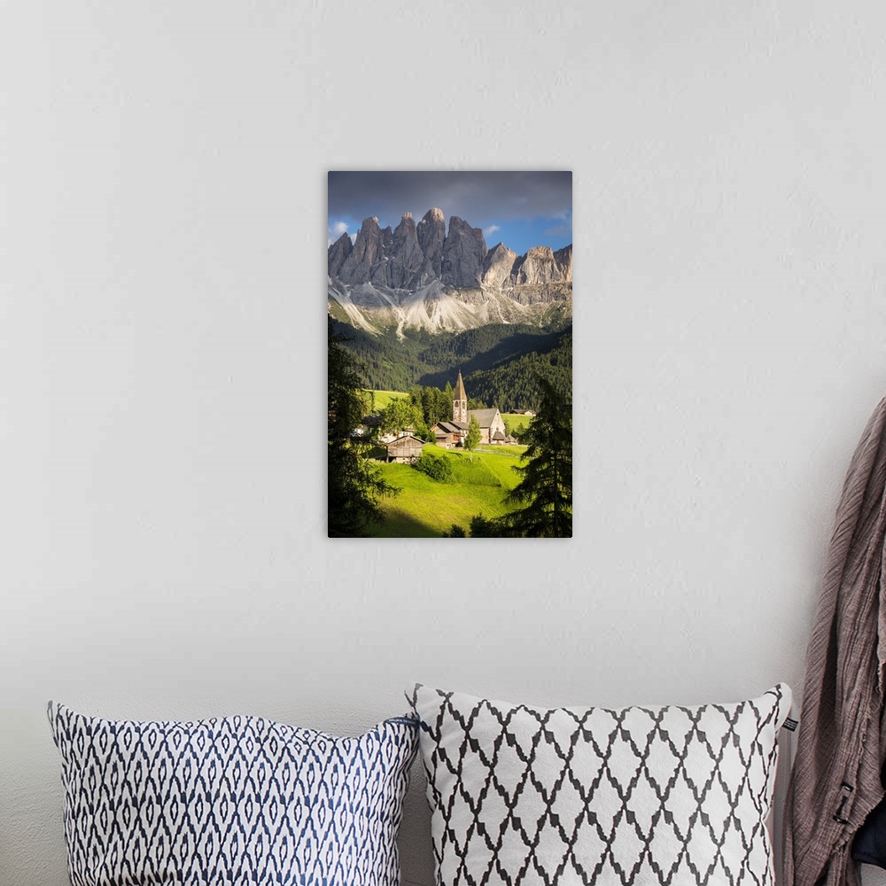 A bohemian room featuring the famous church in S. Maddalena in Villnoss with the Geisler in the background, Bolzano provinc...