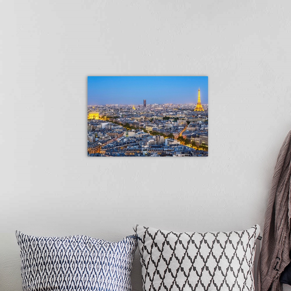 A bohemian room featuring City, Arc de Triomphe and the Eiffel Tower, viewed over rooftops, Paris, France, Europe.