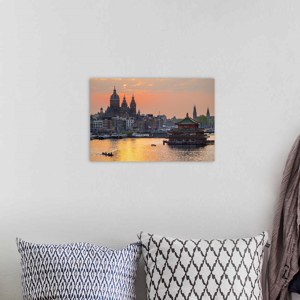 A bohemian room featuring Netherlands, North Holland, Amsterdam. City skyline at sunset with domes of Basilica of Saint Nic...