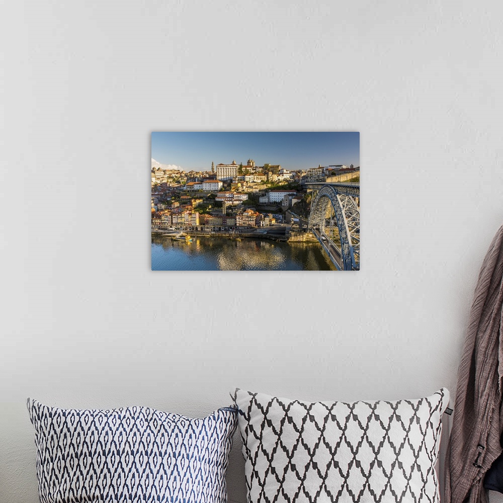A bohemian room featuring City skyline with Douro river and Dom Luis I bridge, Porto, Portugal.