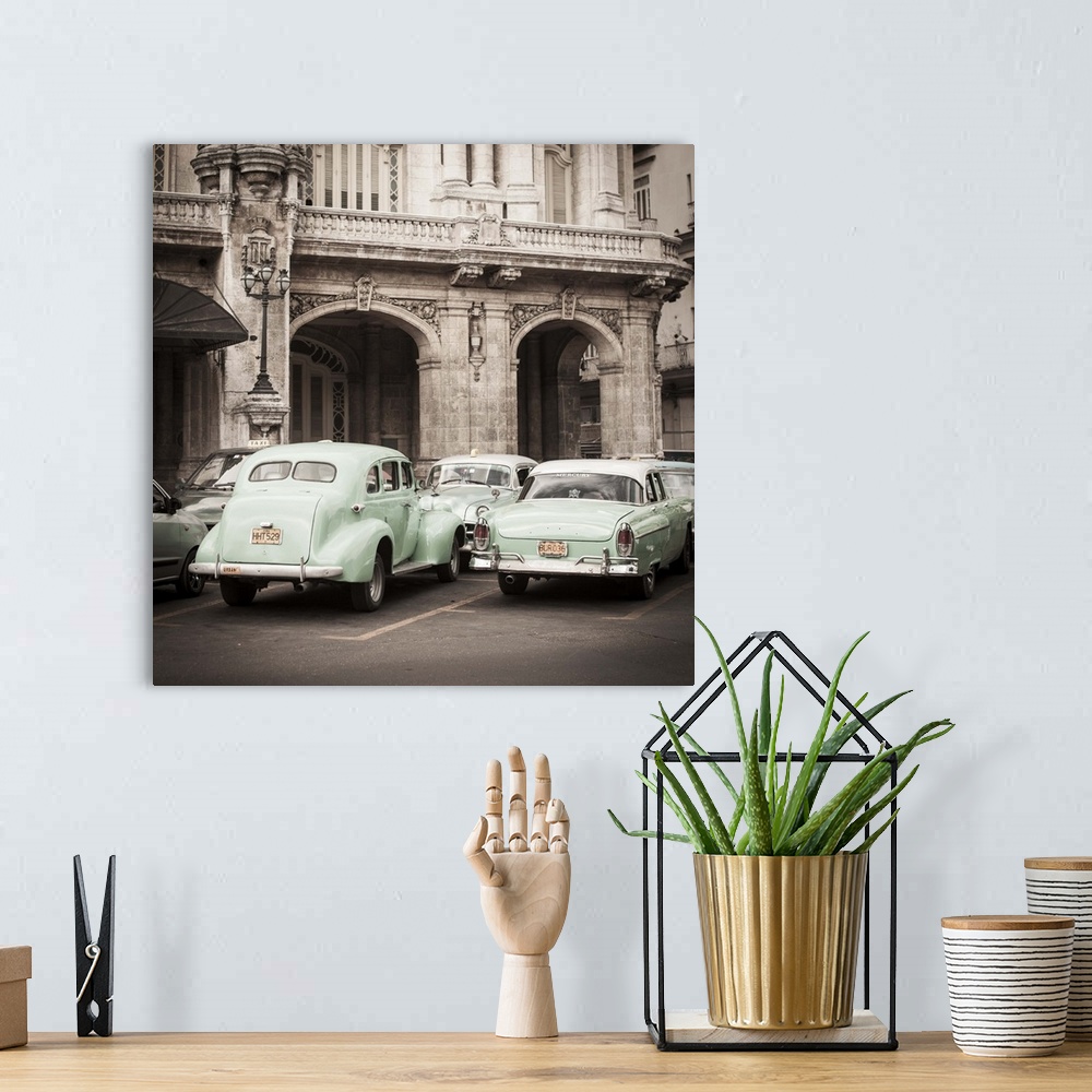A bohemian room featuring Classic American Cars in front of the Gran Teatro, Parque Central, Havana, Cuba
