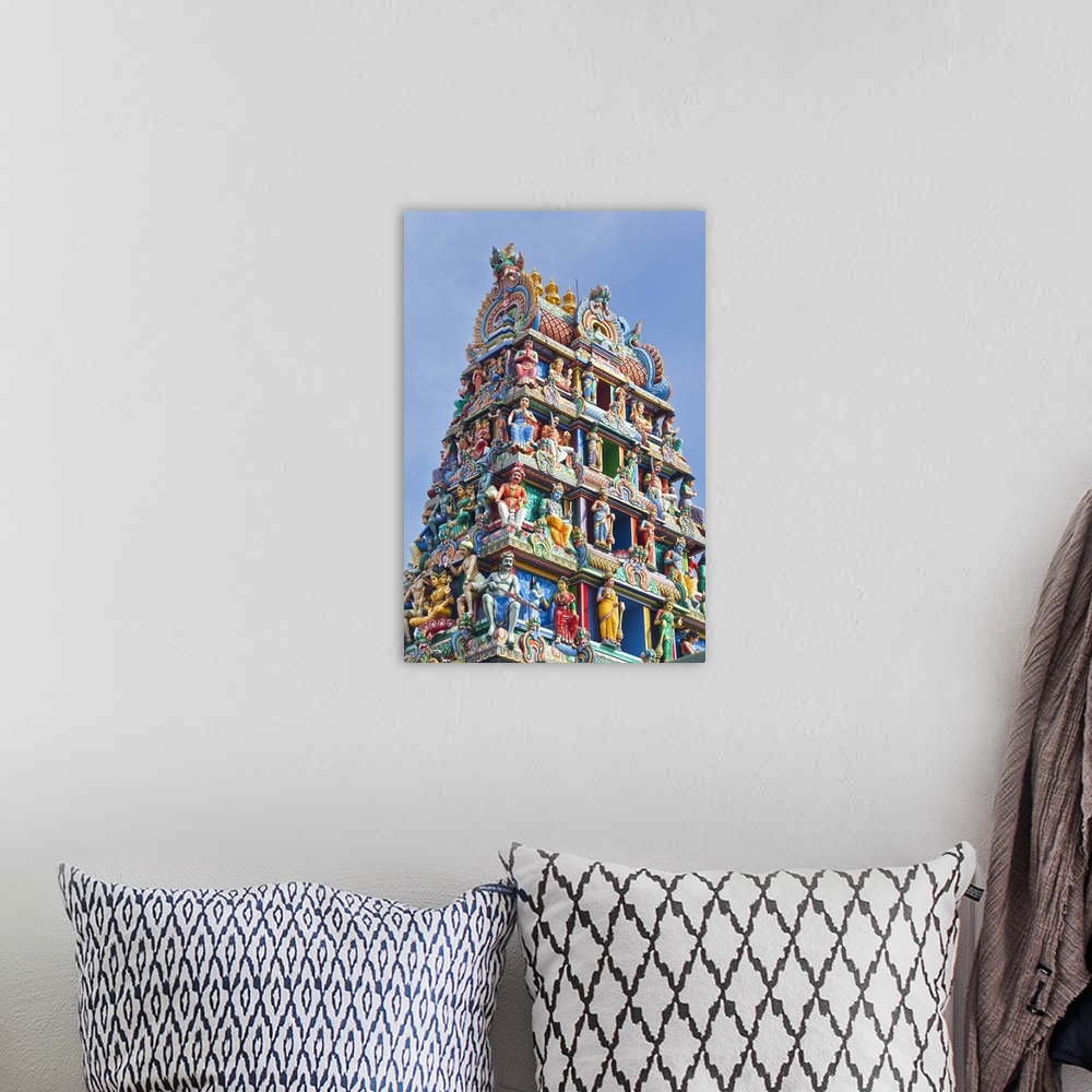 A bohemian room featuring Close up of the Gopuram of the Sri Mariamman Temple in Singapore. A Dravidian style temple in Sin...