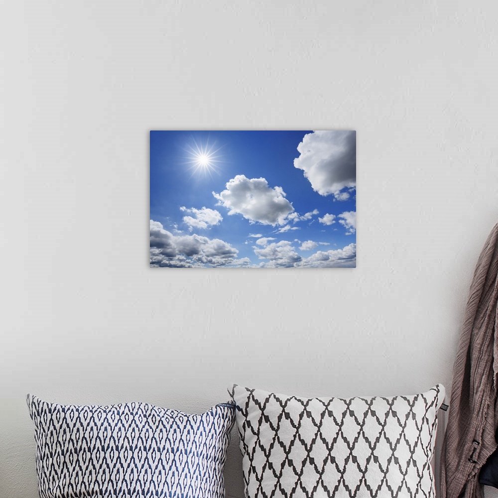 A bohemian room featuring Cloud impression with sun. Germany, Bavaria, Upper Bavaria, Freising, Giggenhausen. Bavaria, West...