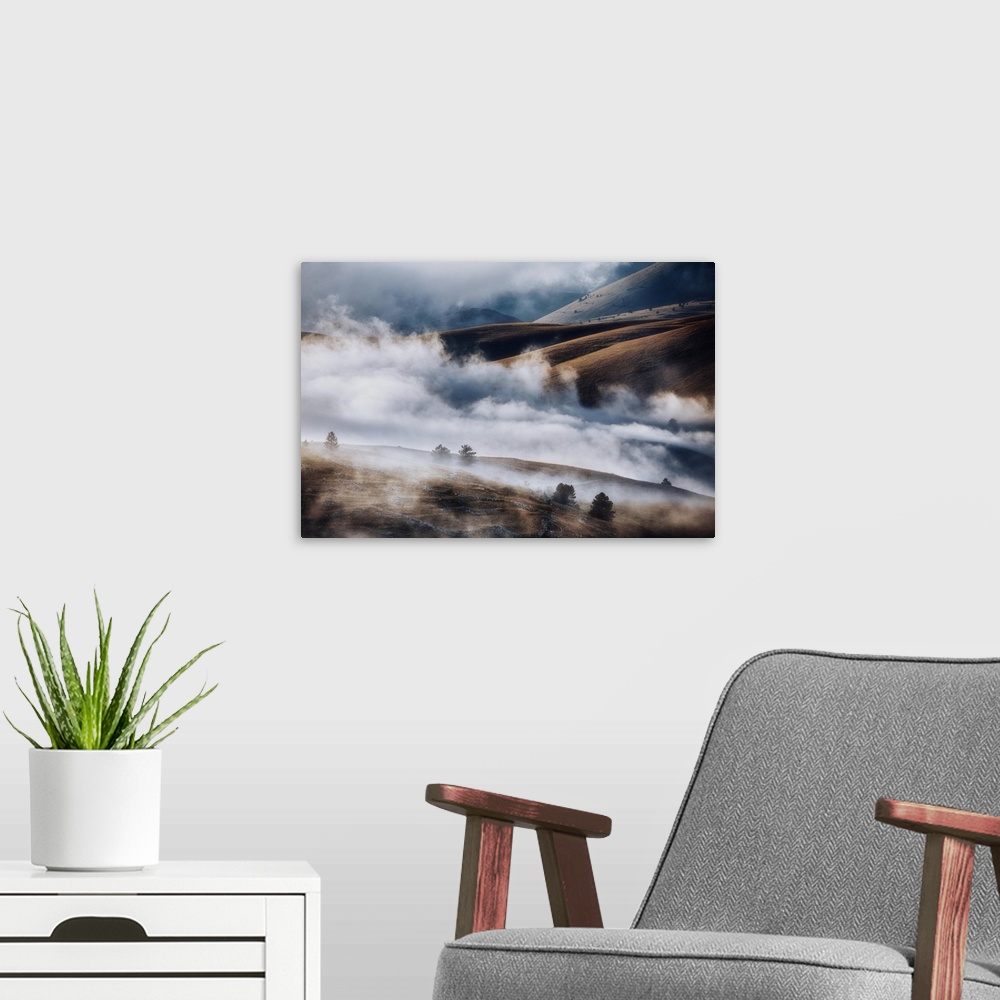 A modern room featuring Cloudscape and wild landscape in Abruzzo, Italy. Hills at sunset