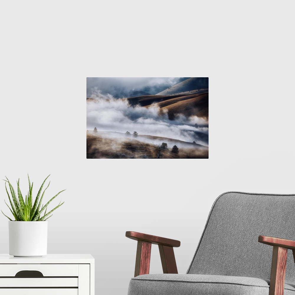 A modern room featuring Cloudscape and wild landscape in Abruzzo, Italy. Hills at sunset