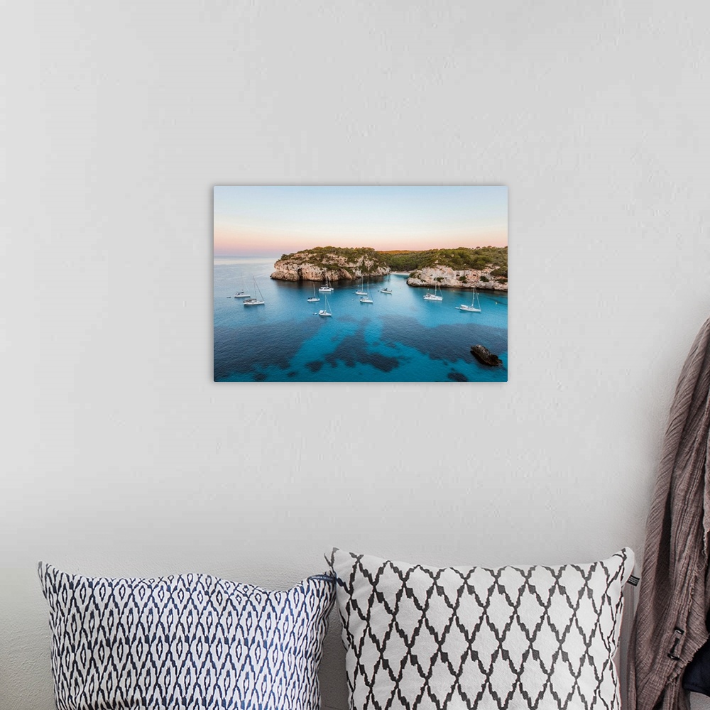 A bohemian room featuring Coastline at sunrise, Punta Macarella, Cala Macarella, Menorca, Balearic Islands, Spain.