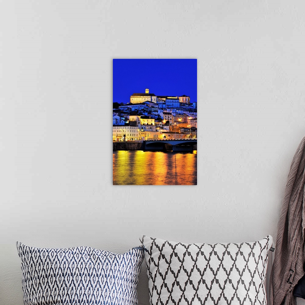 A bohemian room featuring Coimbra and the Mondego river at sunset. Portugal