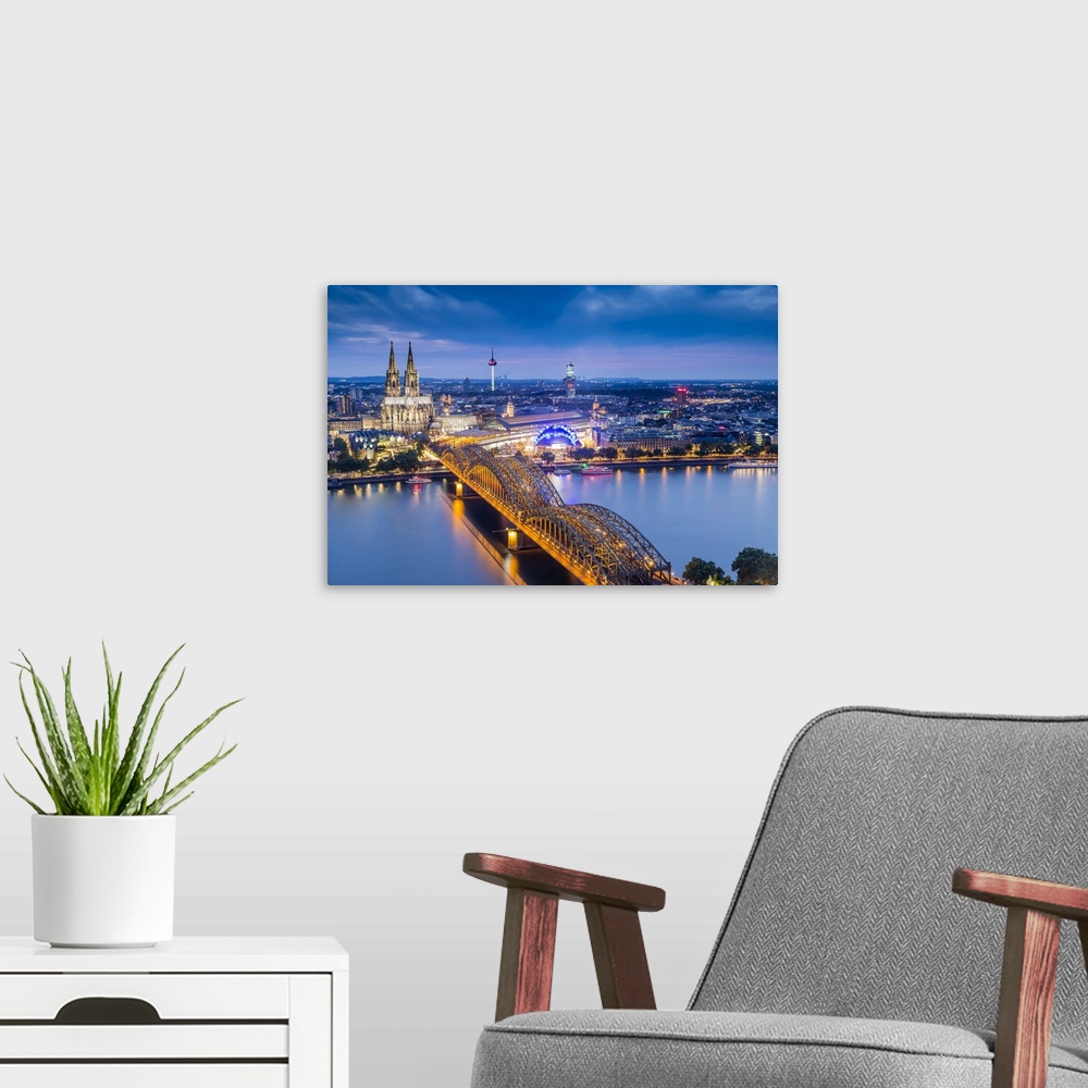 A modern room featuring Cologne Cathedral, River Rhine and Hohenzollern Bridge, Cologne, North Rhine Westphalia, Germany.