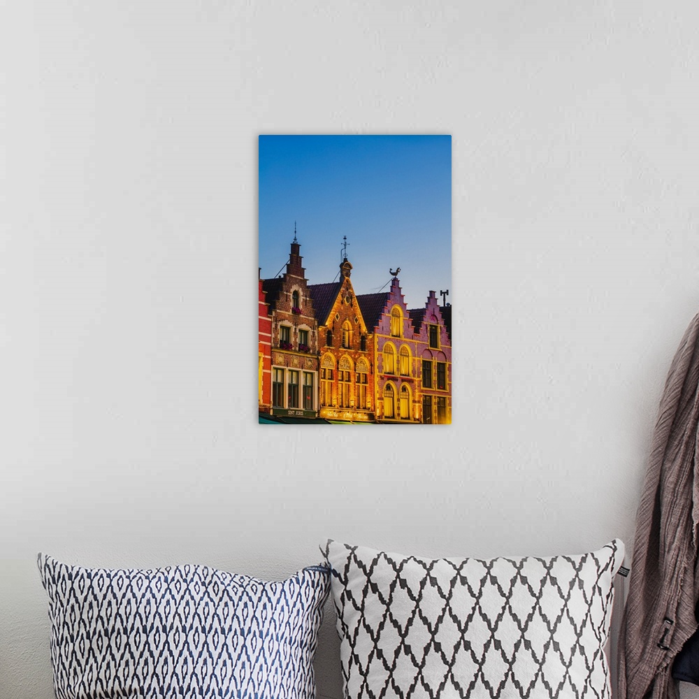 A bohemian room featuring Detail of the colored houses facades in Markt Square in Bruges by night, Belgium