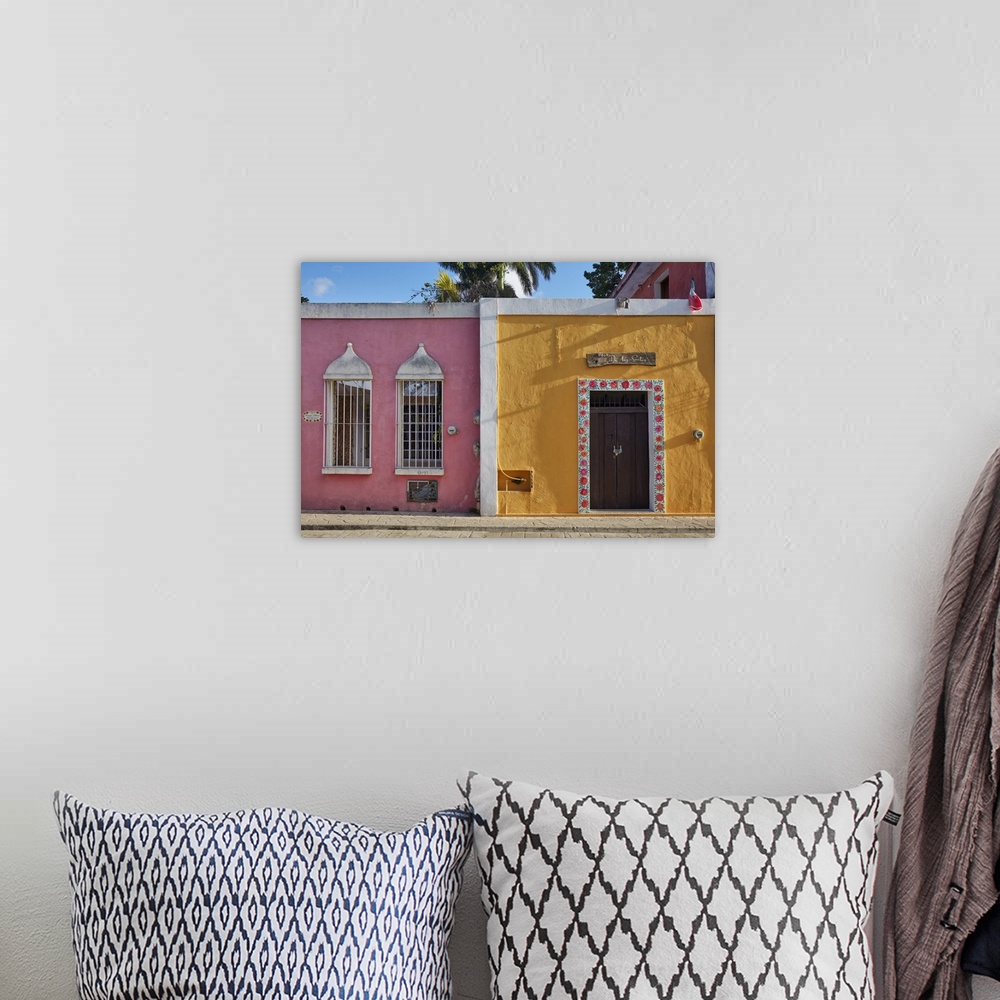 A bohemian room featuring Colorful colonial houses on the "Calzada de los Frailes" street, Valladolid, Yucatan, Mexico.