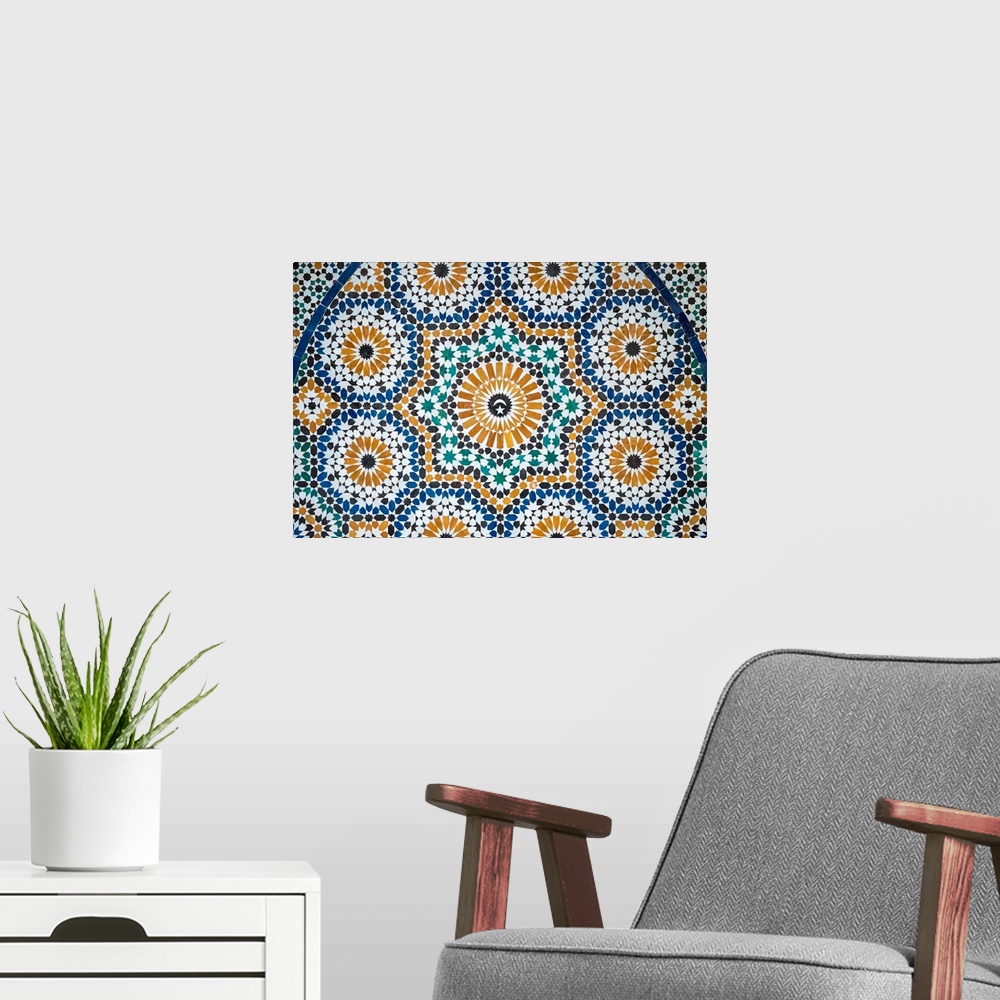 A modern room featuring Morocco, Marrakech-Safi (Marrakesh-Tensift-El Haouz) region, Marrakesh. Colorful tiled mosaic at ...
