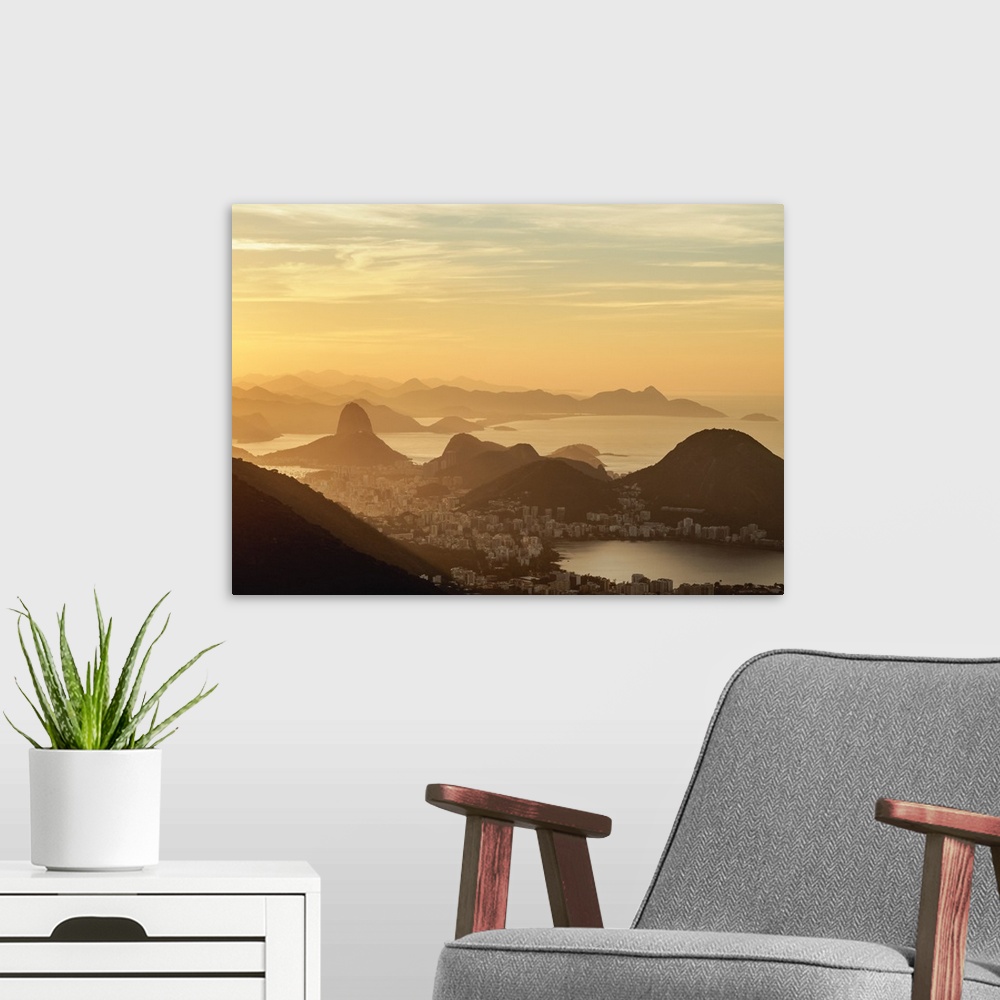 A modern room featuring View towards Corcovado and Sugarloaf Mountains from Tijuca Forest National Park at sunrise, Rio d...