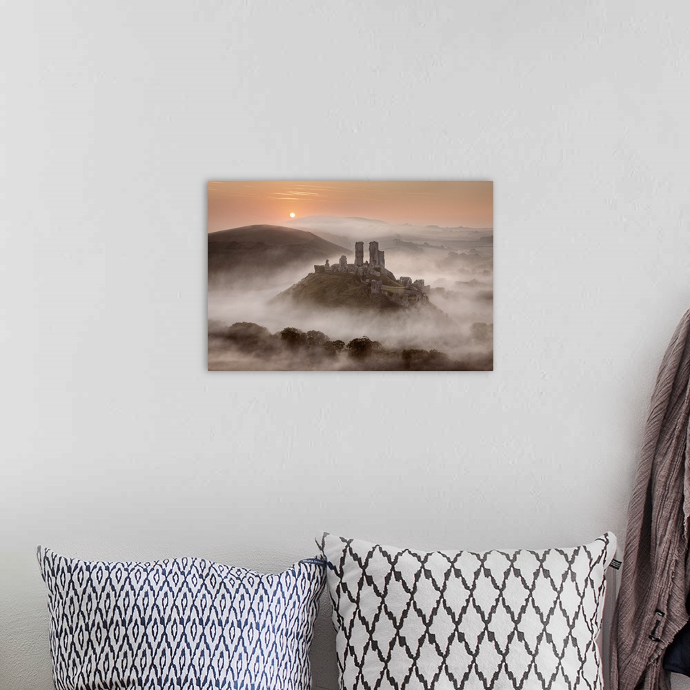 A bohemian room featuring Corfe Castle at dawn surrounded by mist, Dorset, England