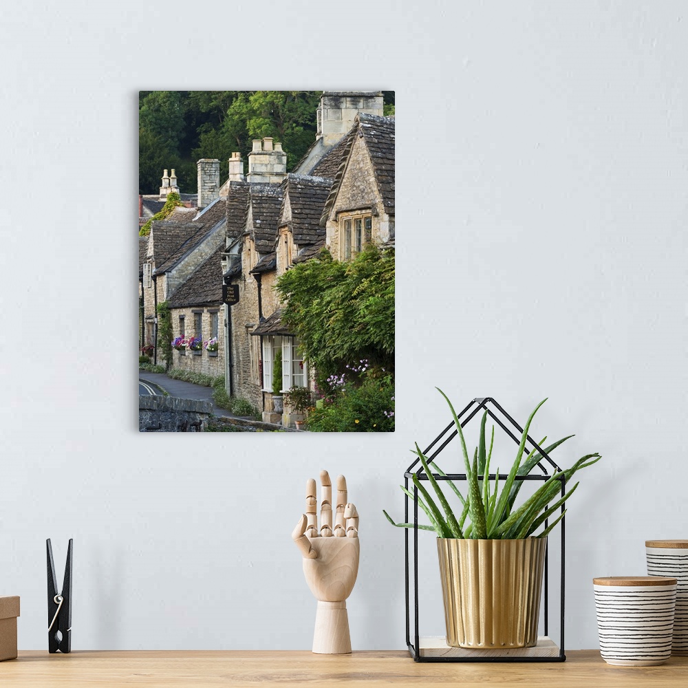 A bohemian room featuring Picturesque cottages in the beautiful Cotswolds village of Castle Combe, Wiltshire, England. Autu...