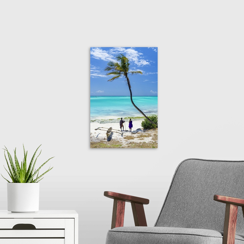 A modern room featuring Couple of Maasai with dhow admiring the crystal sea standing on a palm fringed beach, Zanzibar, T...