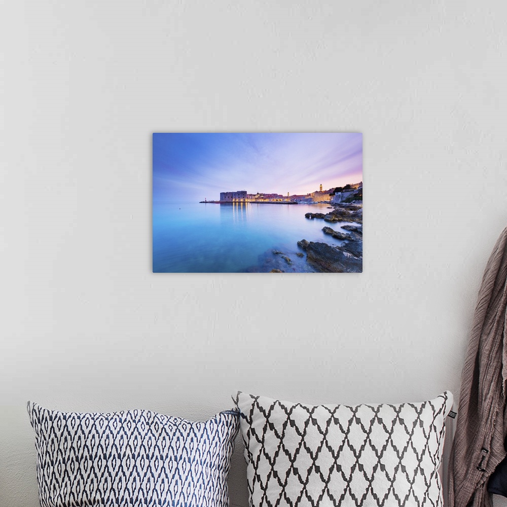 A bohemian room featuring Croatia, Dalmatia, Dubrovnik, Old town, Sunset over the city walls and harbour.