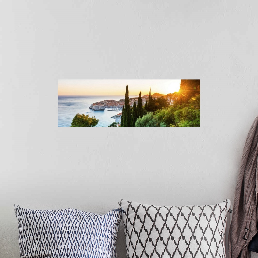 A bohemian room featuring Croatia, Dalmatia, Dubrovnik, Old town, view of the old town at sunset.