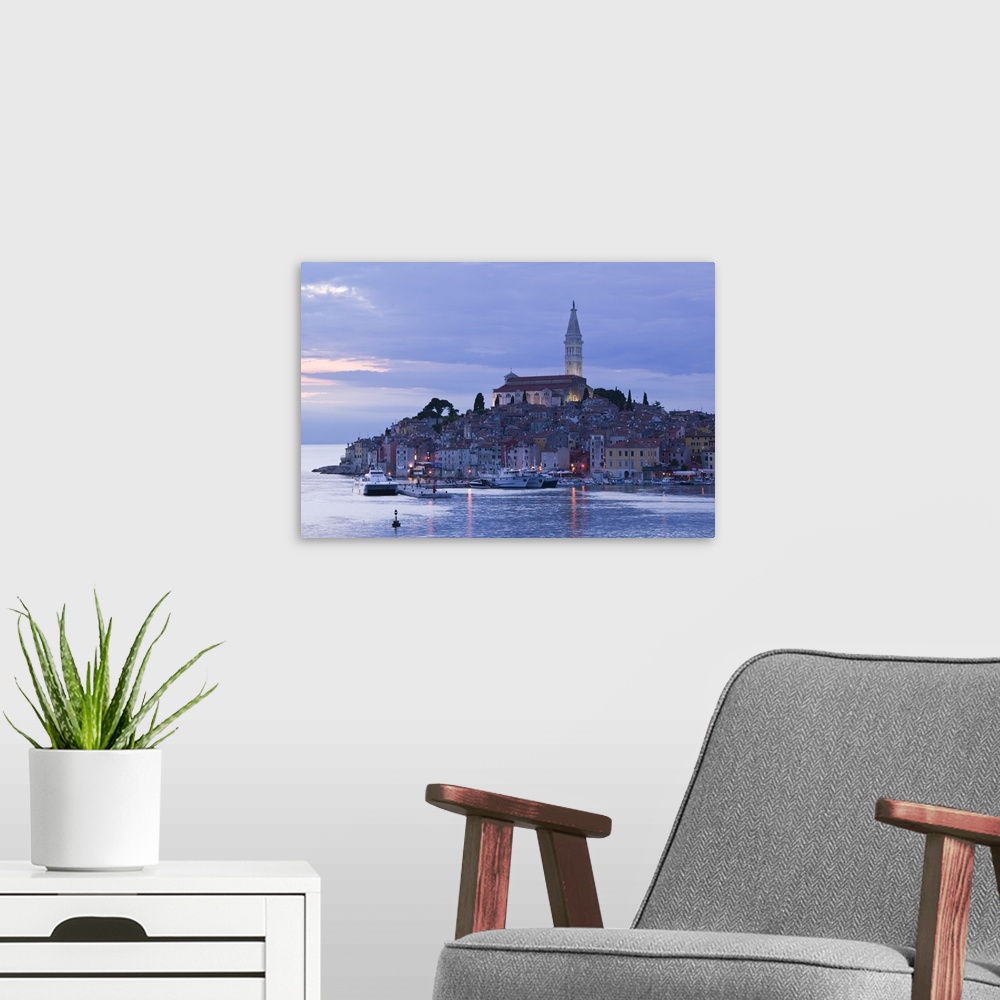 A modern room featuring CROATIA-Istria-ROVINJ:.ROVINJ harbor view with Cathedral of St. Euphemia / Evening