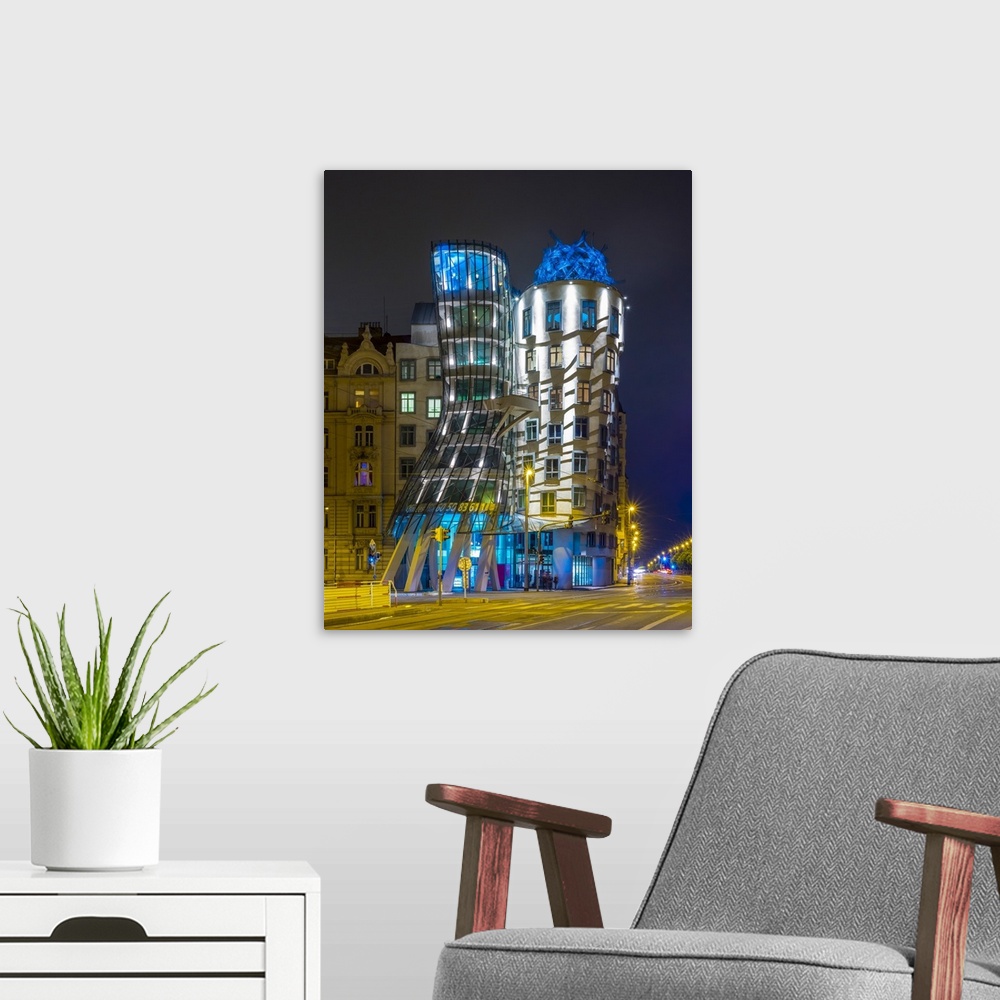 A modern room featuring Czech Republic, Prague, Nove Mesto (New Town). Dancing House, Tancici dum, at night. Designed by ...