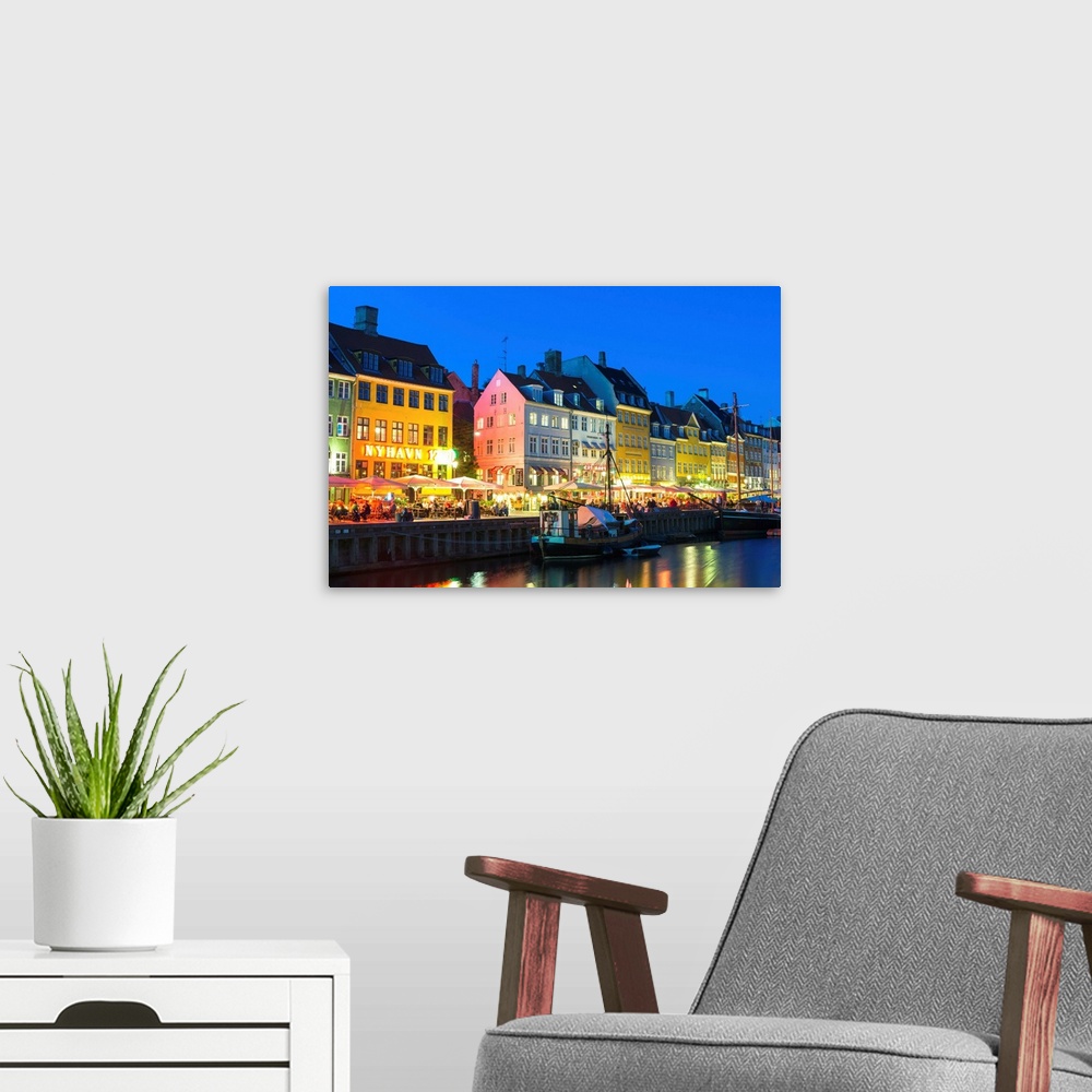 A modern room featuring Denmark, Hillerod, Copenhagen. Colourful buildings along the 17th century waterfront of Nyhavn at...