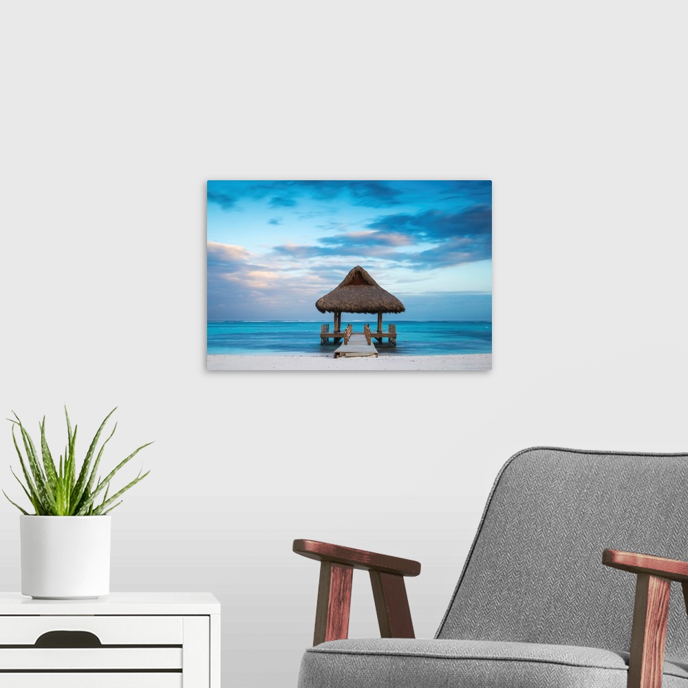 A modern room featuring Dominican Republic, Punta Cana, Playa Blanca, Wooden pier with thatched hut.