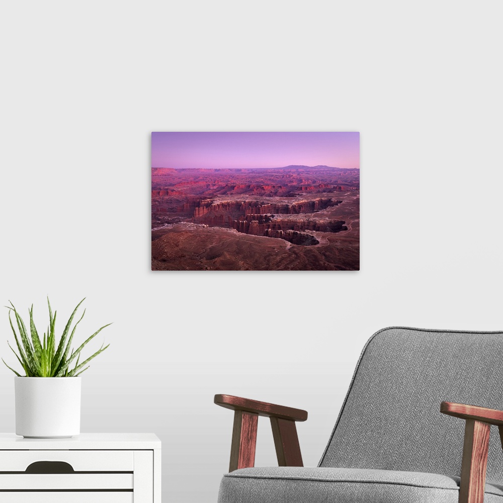 A modern room featuring Dramatic canyon terrain at Grand View Point at sunset, Canyonlands National Park, Utah, USA