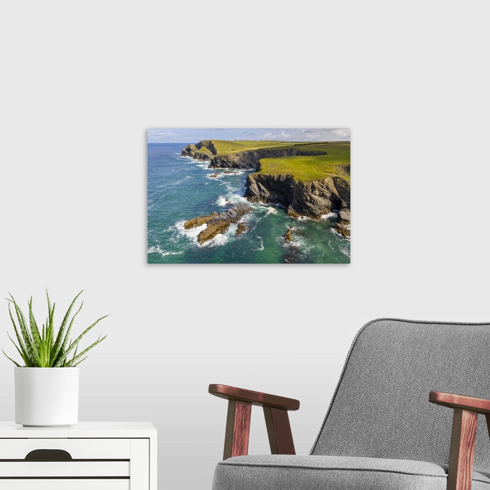 A modern room featuring Dramatic clifftop coastline near Trevone, Cornwall, England. Autumn (September) 2020.