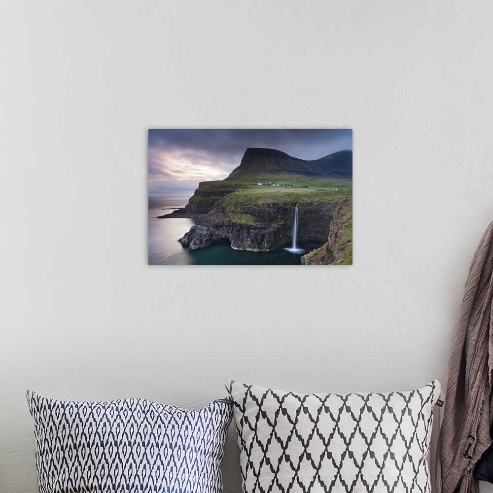 A bohemian room featuring Dramatic coastal scenery at Gasadalur on the island of Vagar, Faroe Islands. Spring