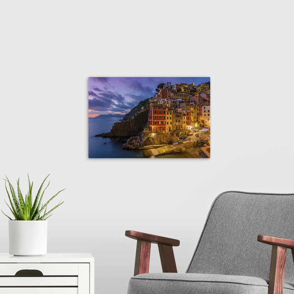A modern room featuring Dusk view of the colorful sea village of Riomaggiore, Cinque Terre, Liguria, Italy
