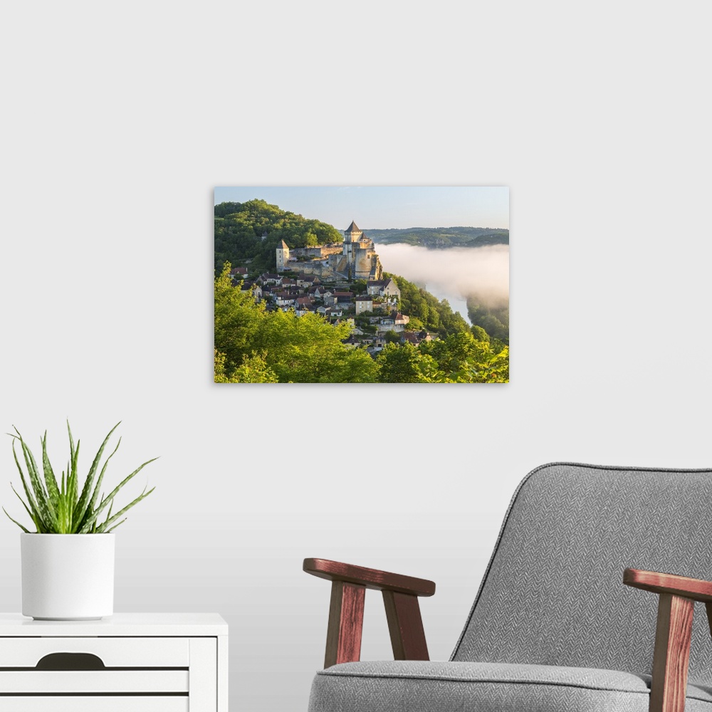 A modern room featuring Early morning mist, Chateau de Castelnaud, Castelnaud, Dordogne, Aquitaine, France.