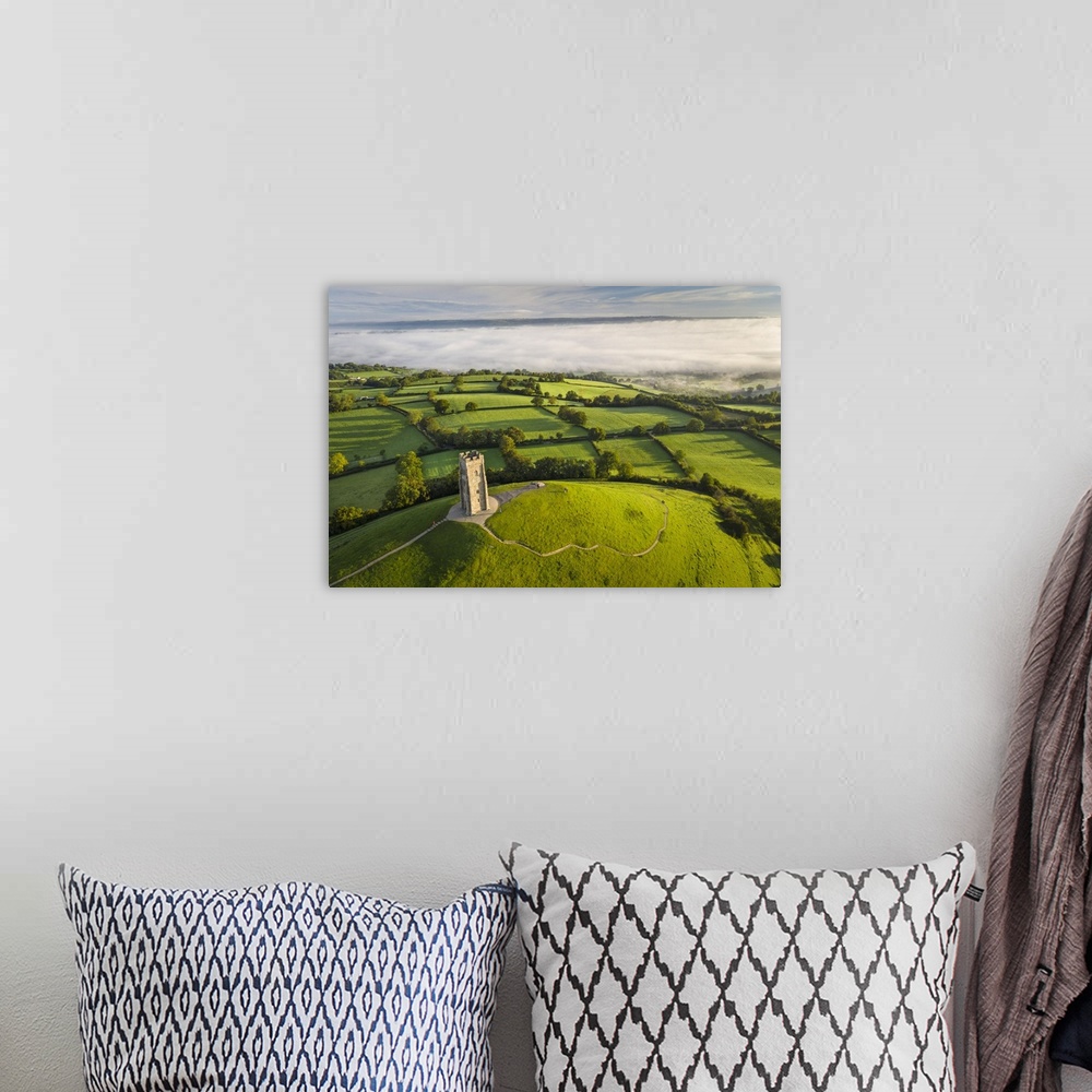 A bohemian room featuring Early morning mists at St Michael's Tower on Glastonbury Tor in Somerset, England. Autumn (Septem...