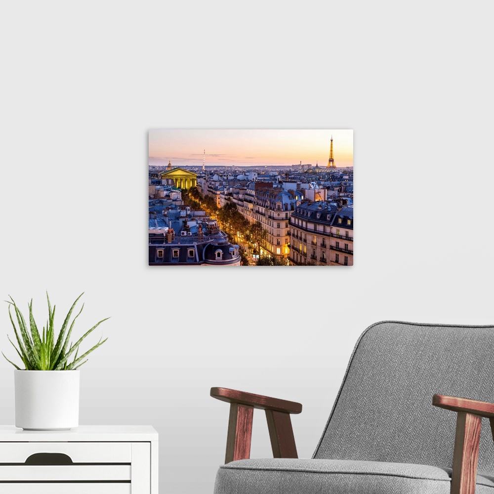 A modern room featuring Eiffel Tower and Paris skyline at dusk, Paris, France.