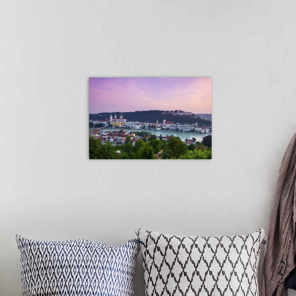 A bohemian room featuring Elevated view over Old Town Passau and The River Danube illuminated at Dawn, Passau, Lower Bavari...