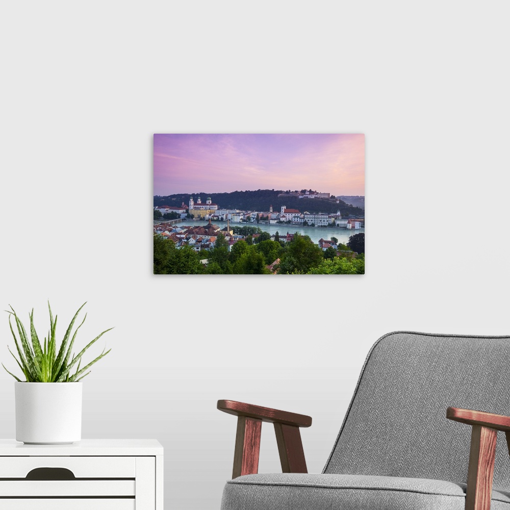 A modern room featuring Elevated view over Old Town Passau and The River Danube illuminated at Dawn, Passau, Lower Bavari...