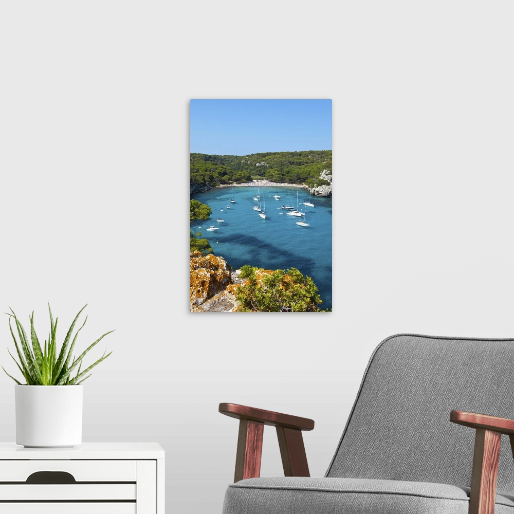 A modern room featuring Elevated view over the idyllic bay/beach of Cala Macarelleta, Menorca, Baleric Islands, Spain
