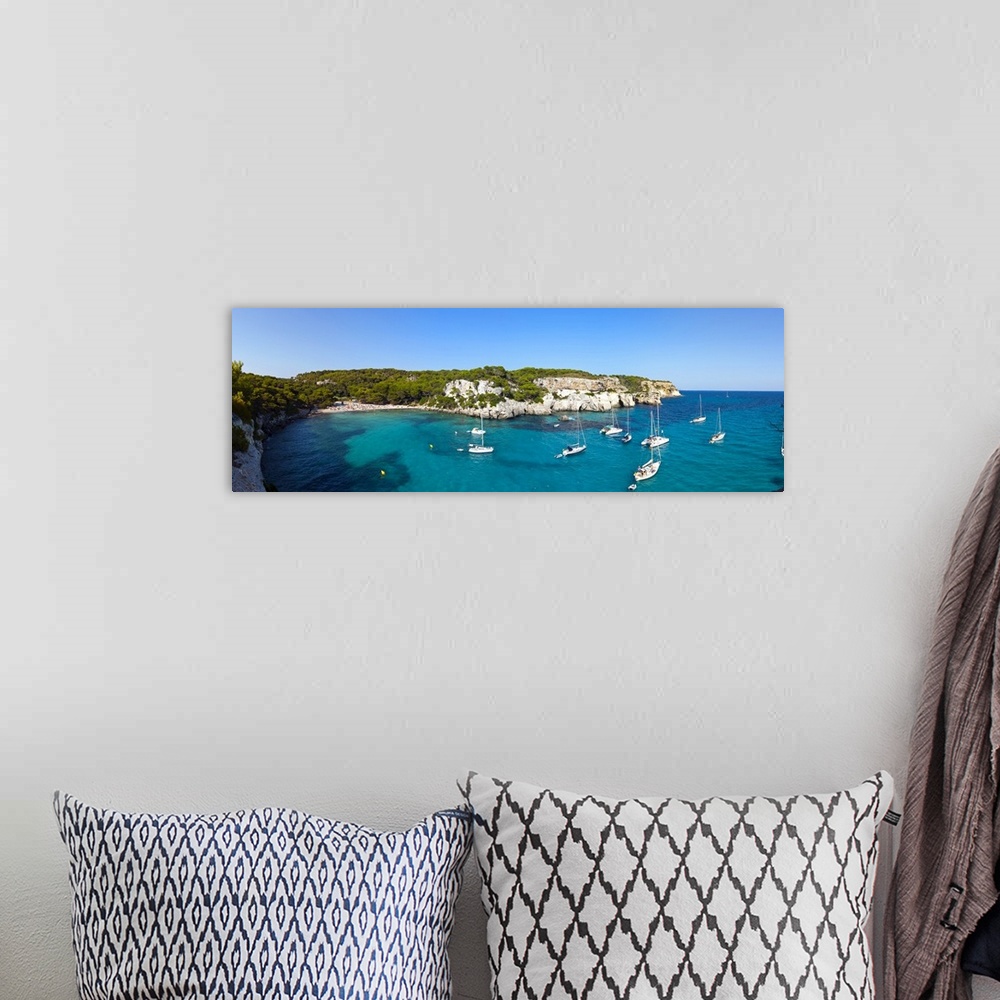 A bohemian room featuring Elevated view over the idyllic bay/beach of Cala Macarelleta, Menorca, Baleric Islands, Spain