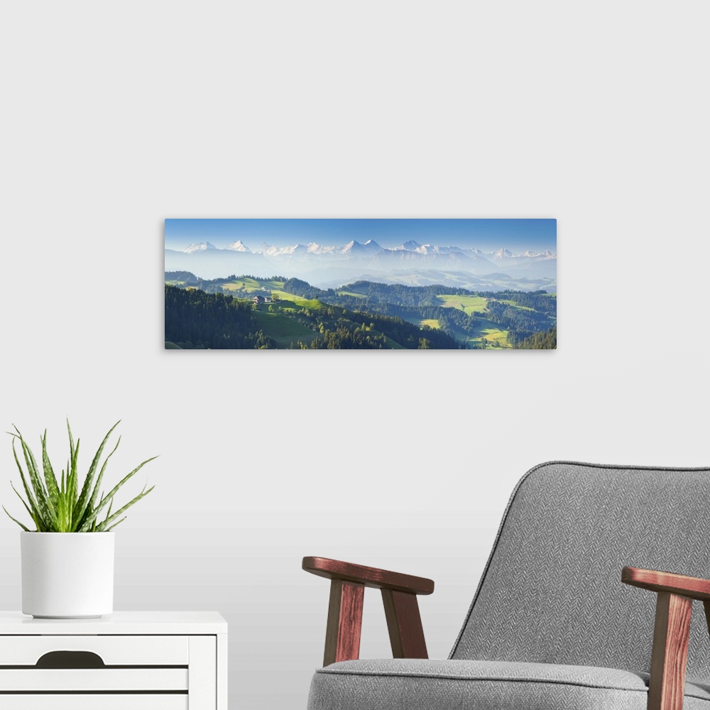 A modern room featuring Emmental Valley and Swiss alps in the background, Berner Oberland, Switzerland