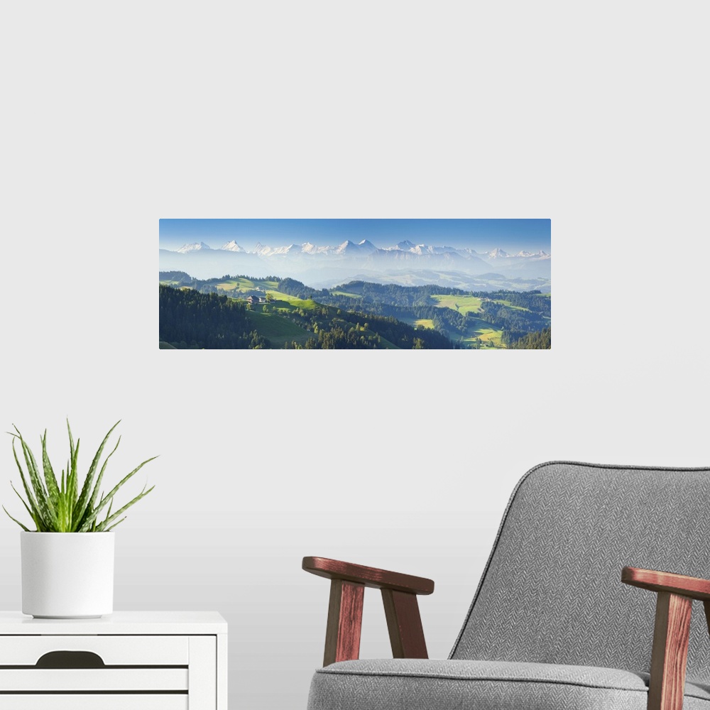 A modern room featuring Emmental Valley and Swiss alps in the background, Berner Oberland, Switzerland
