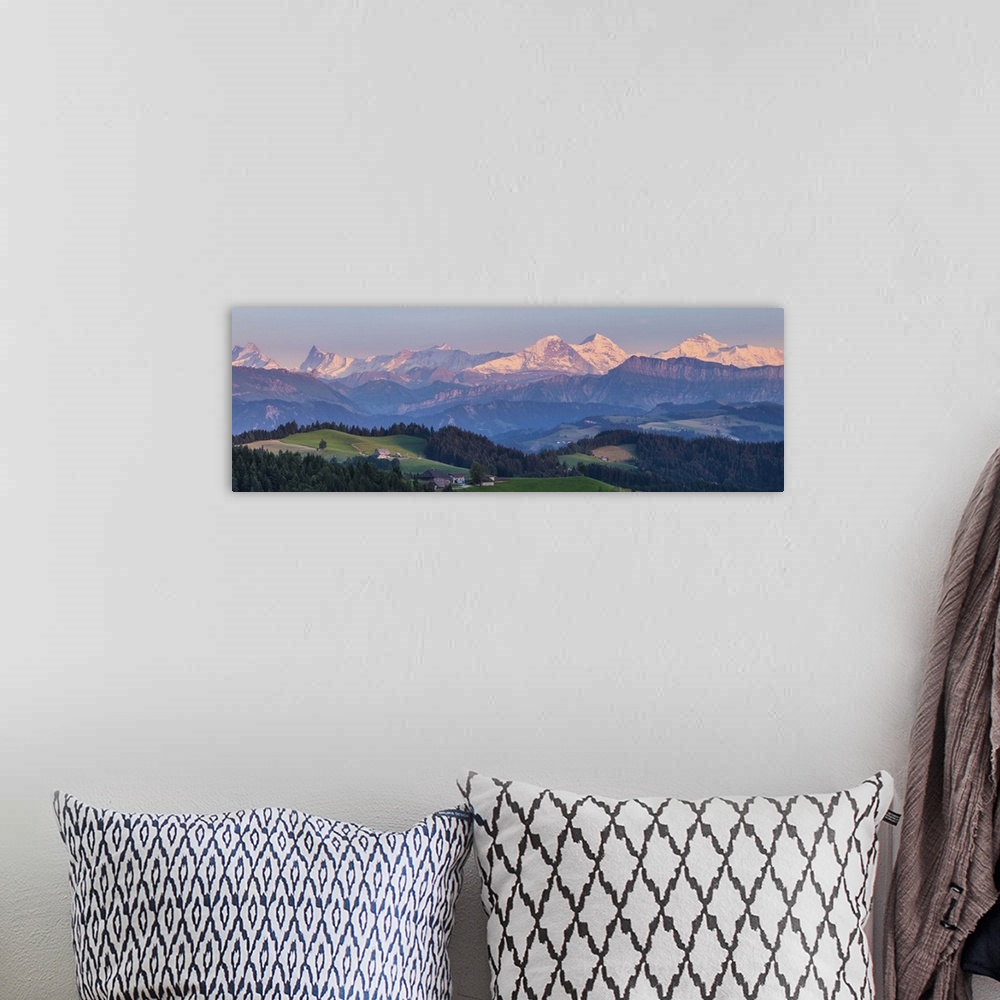 A bohemian room featuring Emmental Valley and Swiss alps in the background, Berner Oberland, Switzerland
