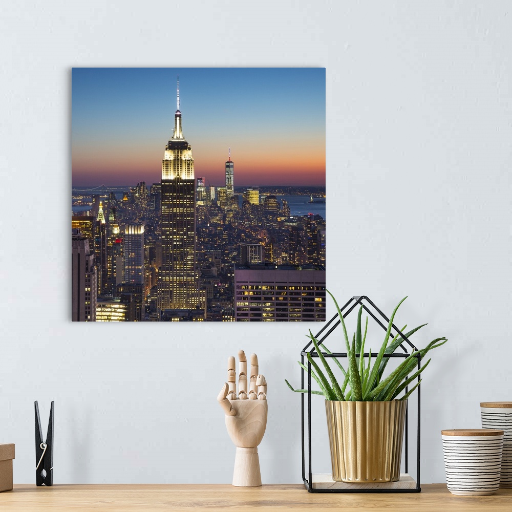 A bohemian room featuring Empire State Building (One World Trade Center behind), Manhattan, New York City, New York, USA.