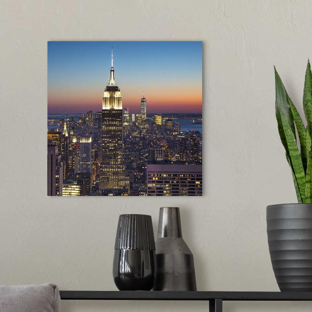 A modern room featuring Empire State Building (One World Trade Center behind), Manhattan, New York City, New York, USA.