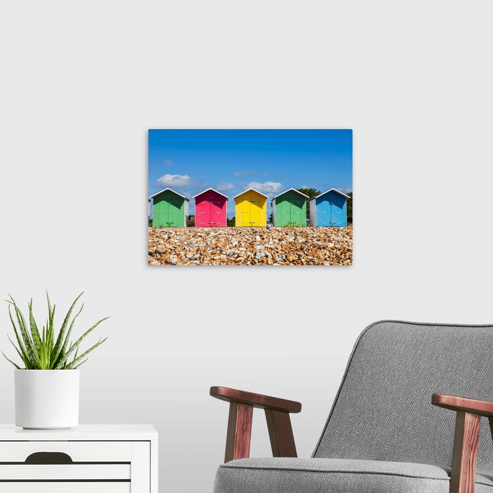 A modern room featuring England, East Sussex, Eastbourne, Eastbourne Beach, Colourful Beach Huts.