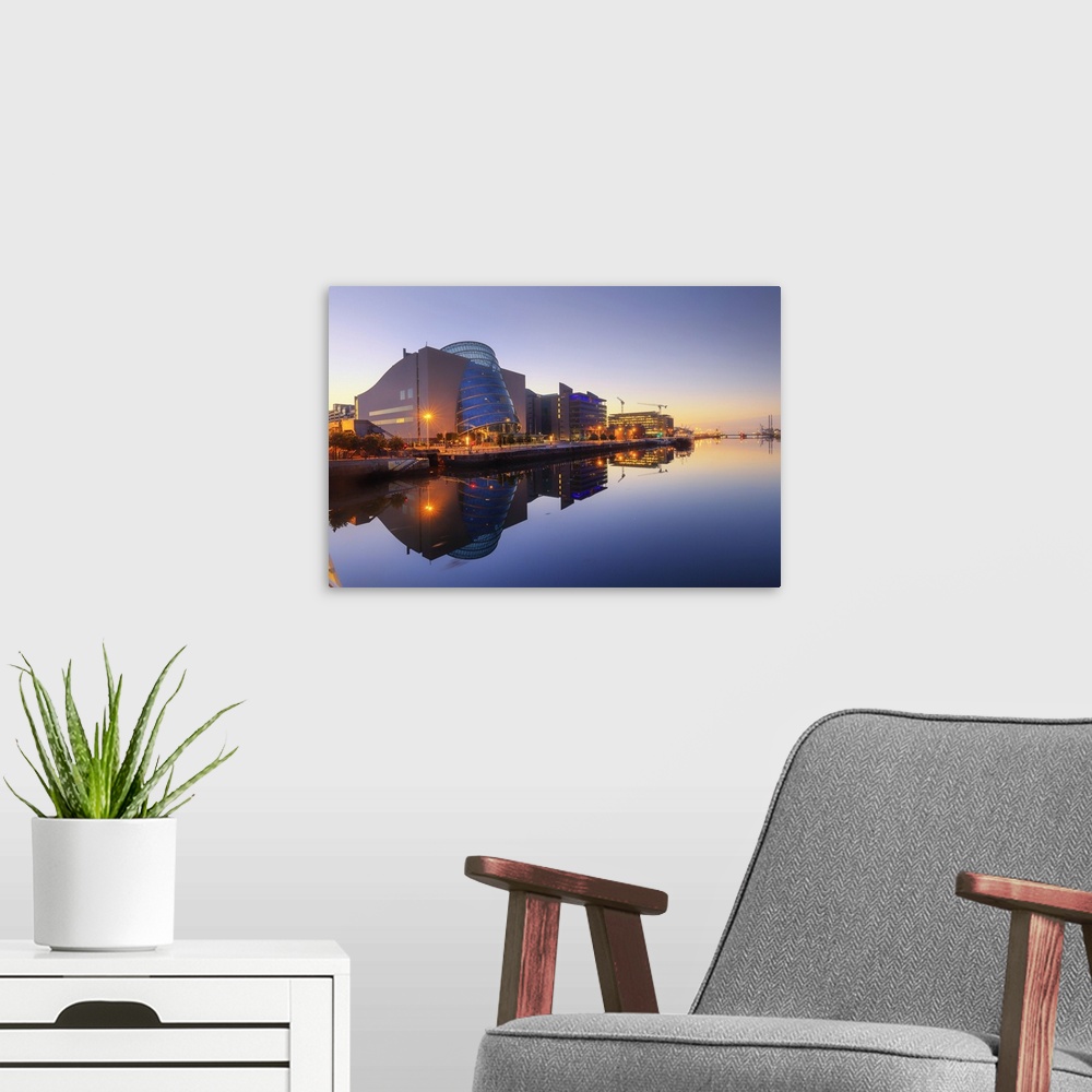 A modern room featuring Europe, Dublin, Ireland, buildings reflecting on the Liffey river by night